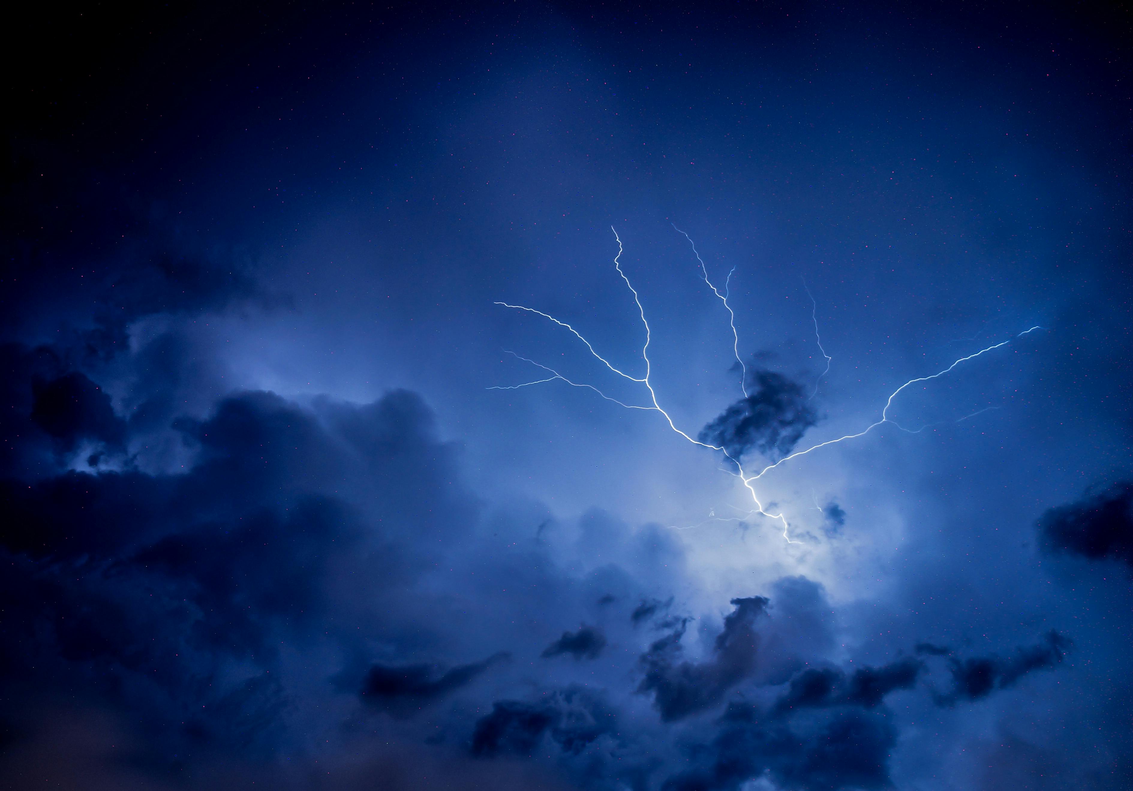 Download A shot of an eyecatching lightning strike in a night sky Wallpaper   Wallpaperscom