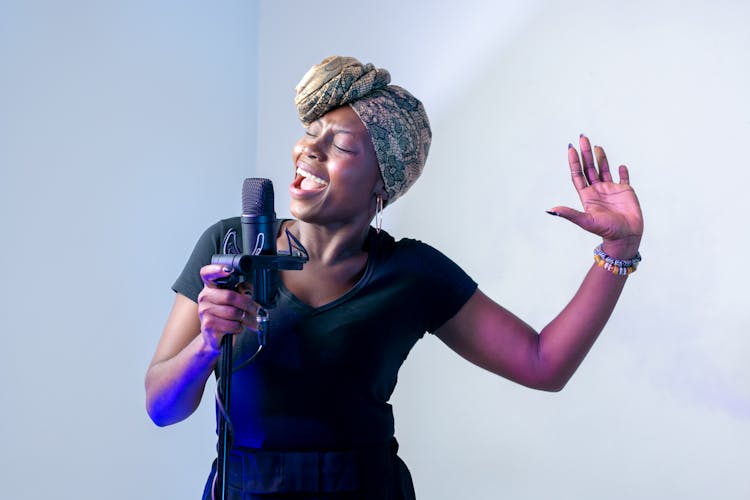 Photo Of Woman Singing In Music Studio