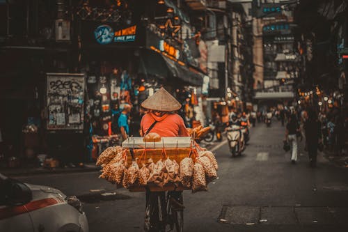 Photo of a Person Selling Snack on a Bicycle