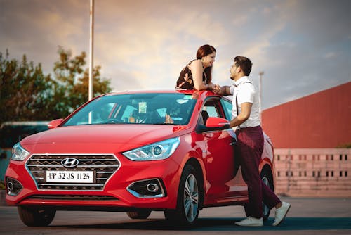 Man And Woman On A Car