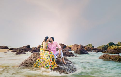 Free Photo of a Couple Sitting on Rock Stock Photo