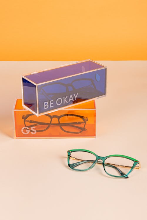 Free Chic Eyewear Display: Vibrant Boxes and Stylish Glasses Stock Photo
