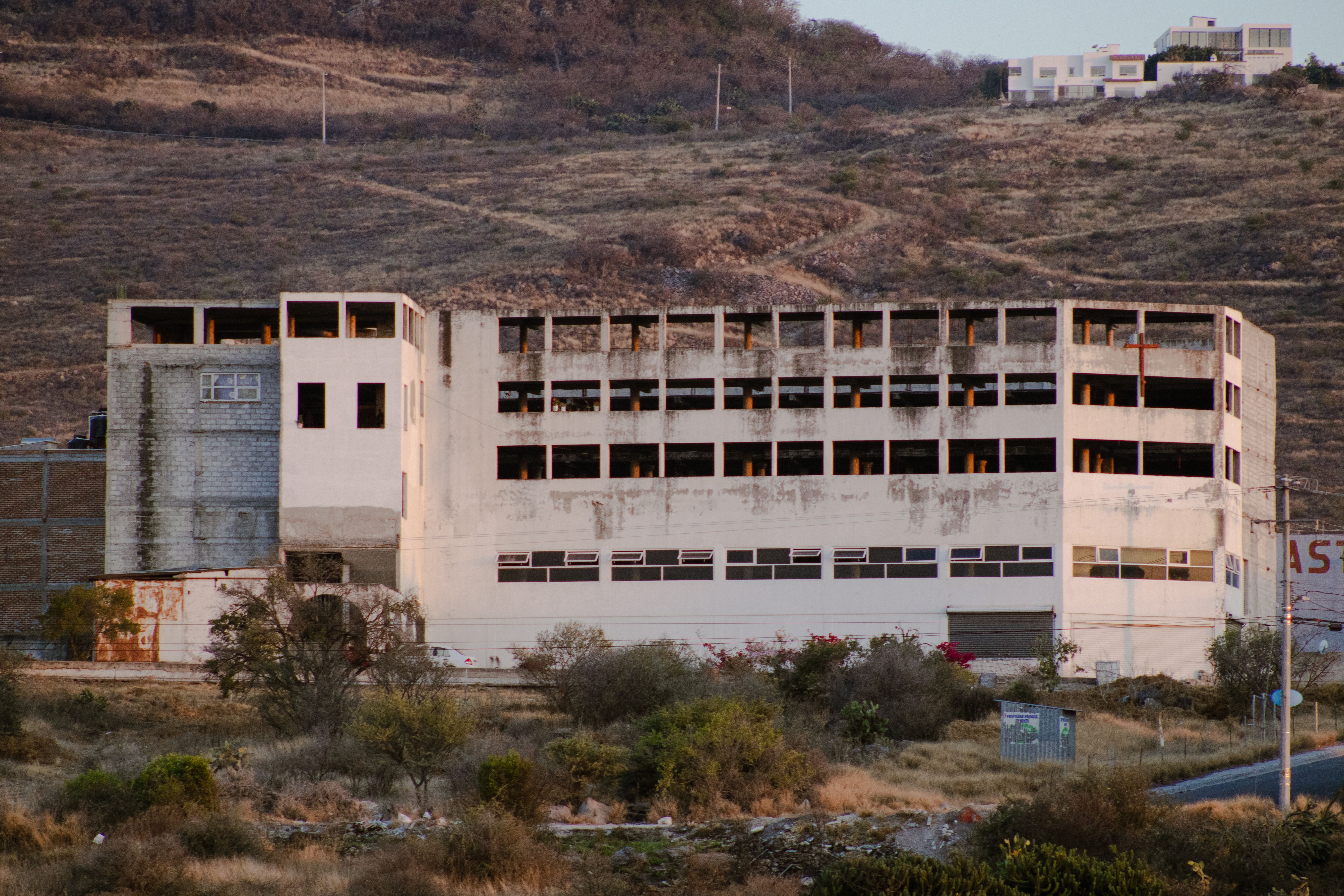 Derelict structure surrounded by hills in Santiago de Querétaro, Mexico.