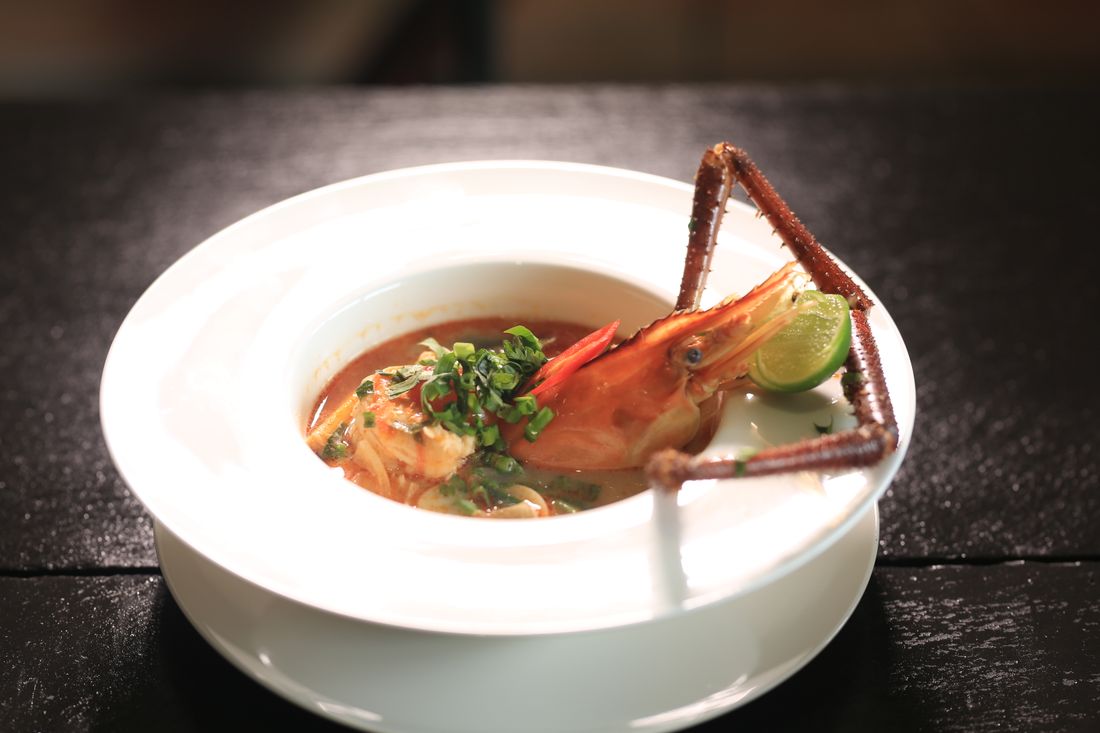 Cambodian coconut seafood soup with lime and herbs