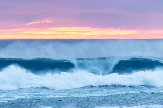 Captivating view of ocean waves crashing against the shore at sunset in Johanna, VIC, Australia.