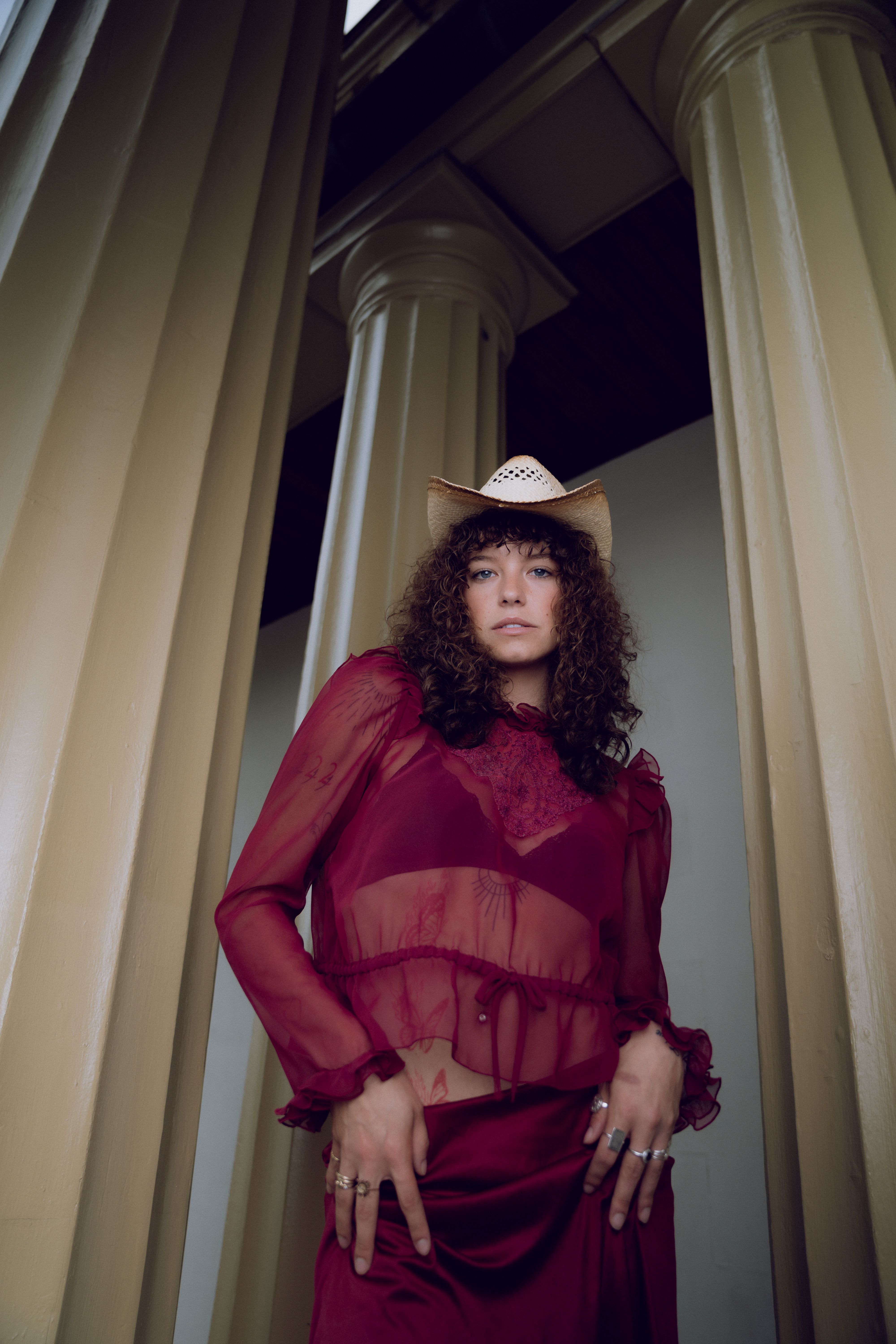 A woman in a red dress and cowboy hat · Free Stock Photo