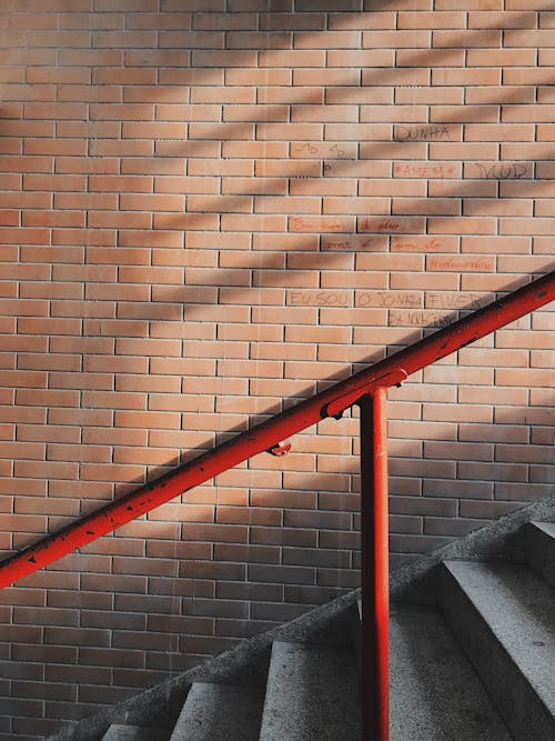 Photo of Stairs Near Brick Wall