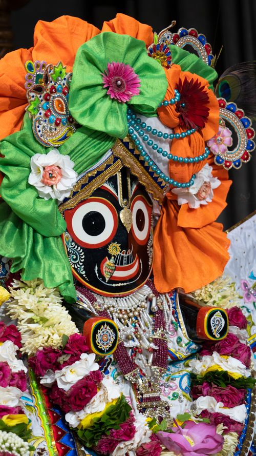 Free Vibrant Jagannath deity ornamented with colorful flowers and decorations, showcasing festive spirit and cultural heritage. Stock Photo