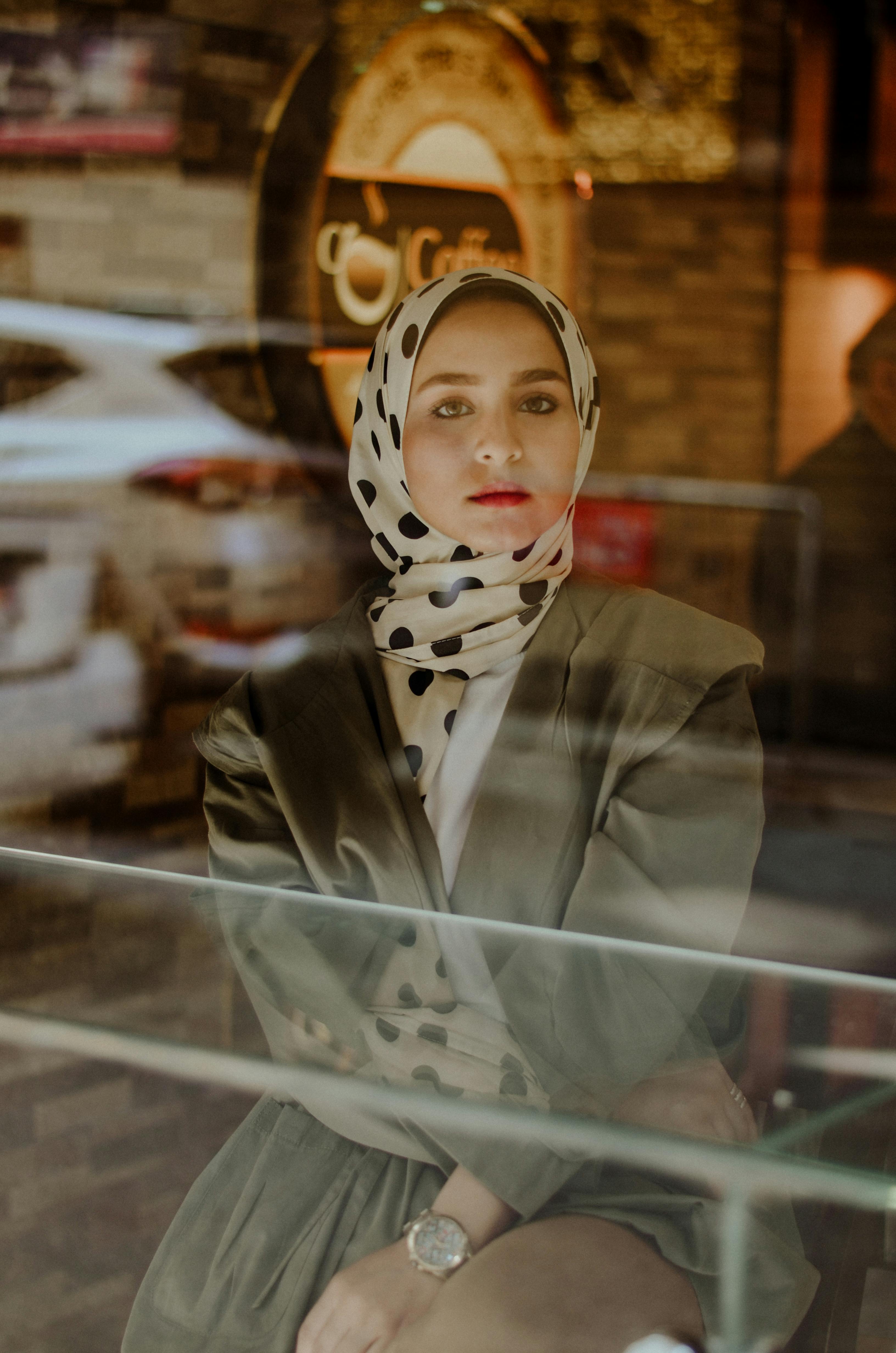 photo of woman sitting on chair