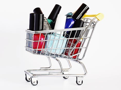 Colorful nail polish bottles in a mini shopping cart against white background.
