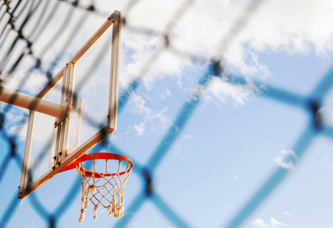 Free Low-Angle Photo of Basketball Hoop Under Blue Sky Stock Photo