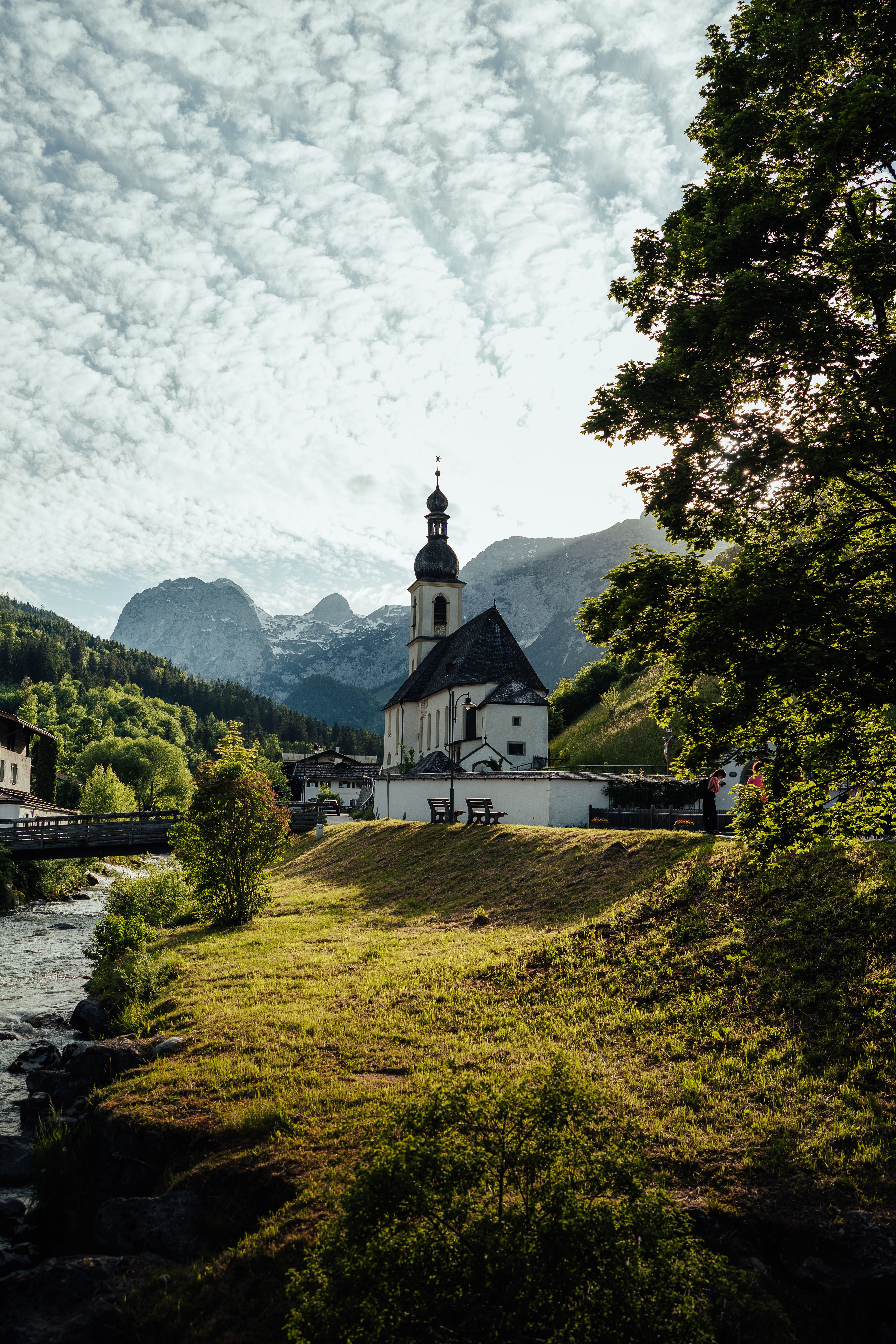 A church in the mountains with a river running through it · Free Stock ...
