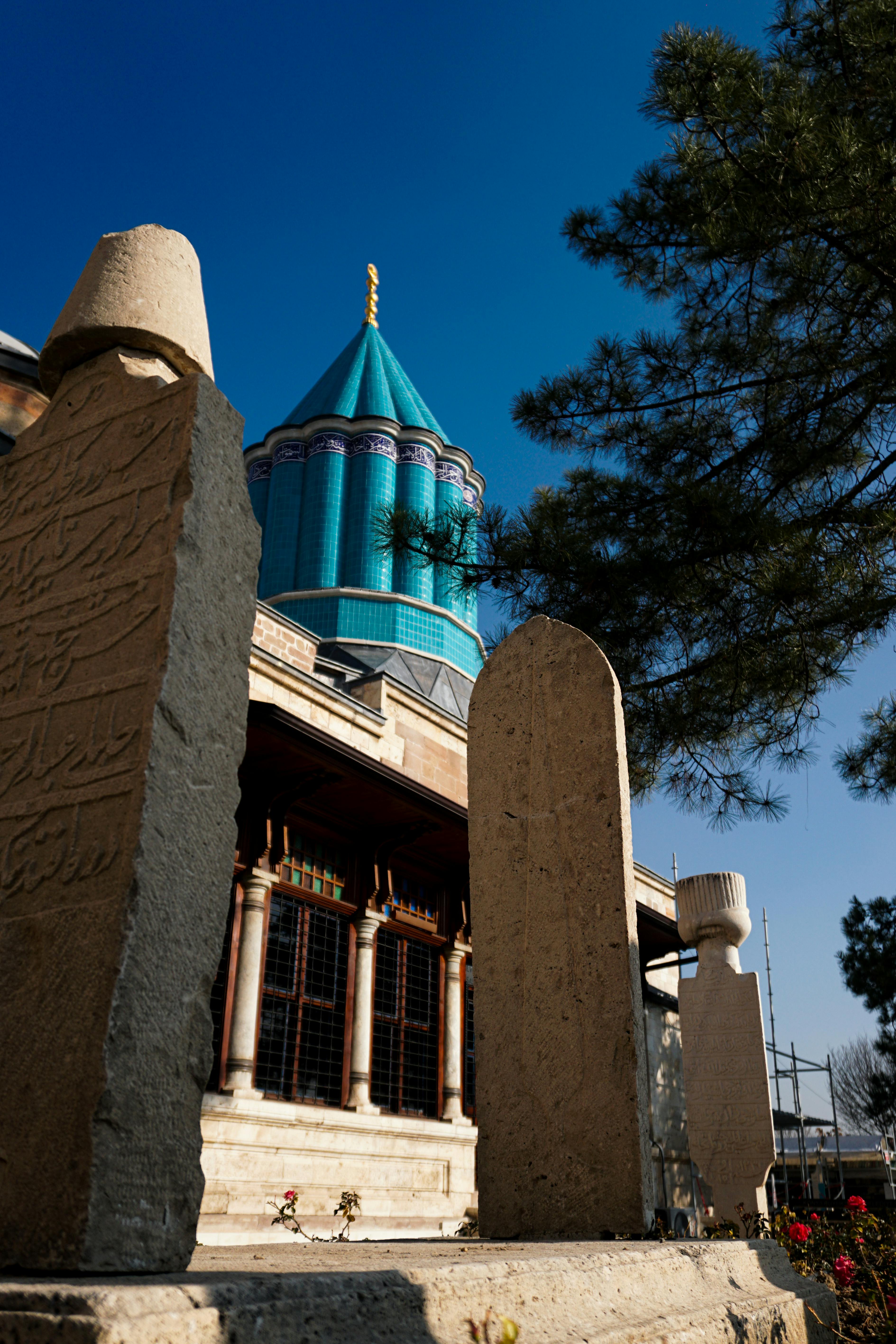 View of the iconic Mevlana Museum tower in Konya, highlighting its unique architecture.