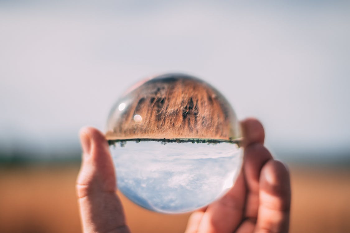 Free Close-Up Photo of Person Holding Lensball Stock Photo