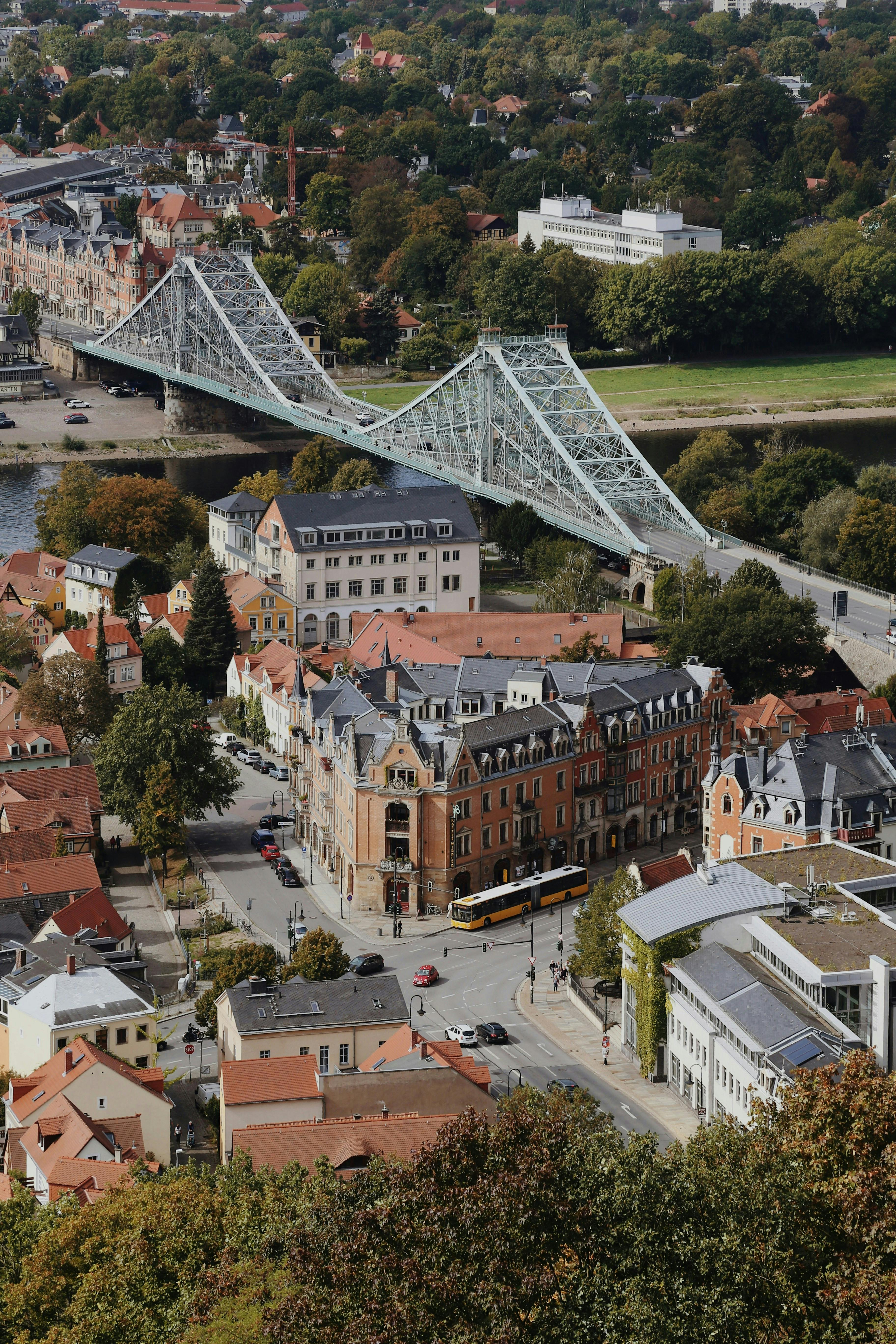 A stunning aerial view of Loschwitz Bridge in Dresden, Germany, showcasing urban architecture.