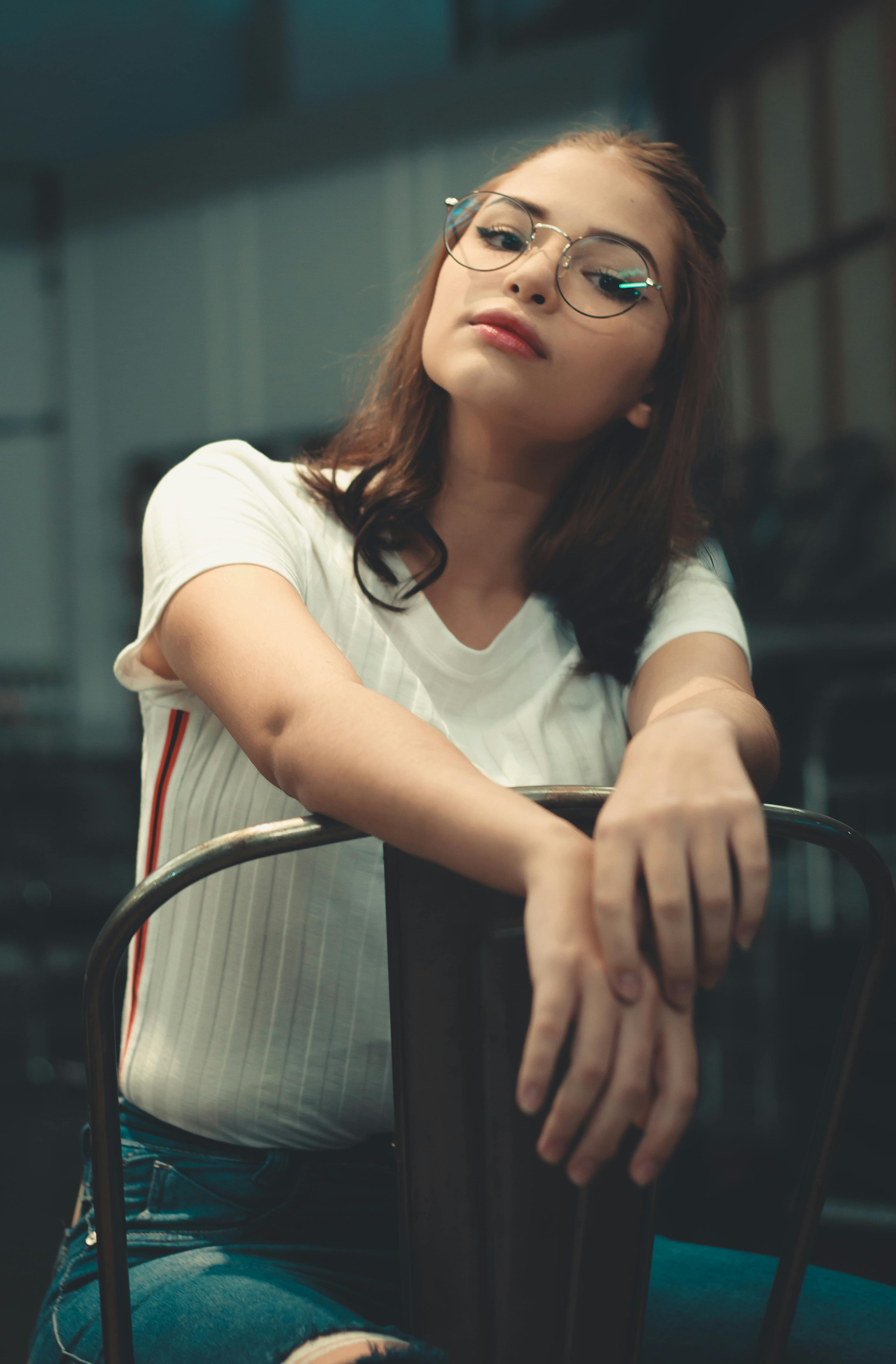 Woman in White Long Sleeve Dress Sitting on White Wooden Chair · Free ...