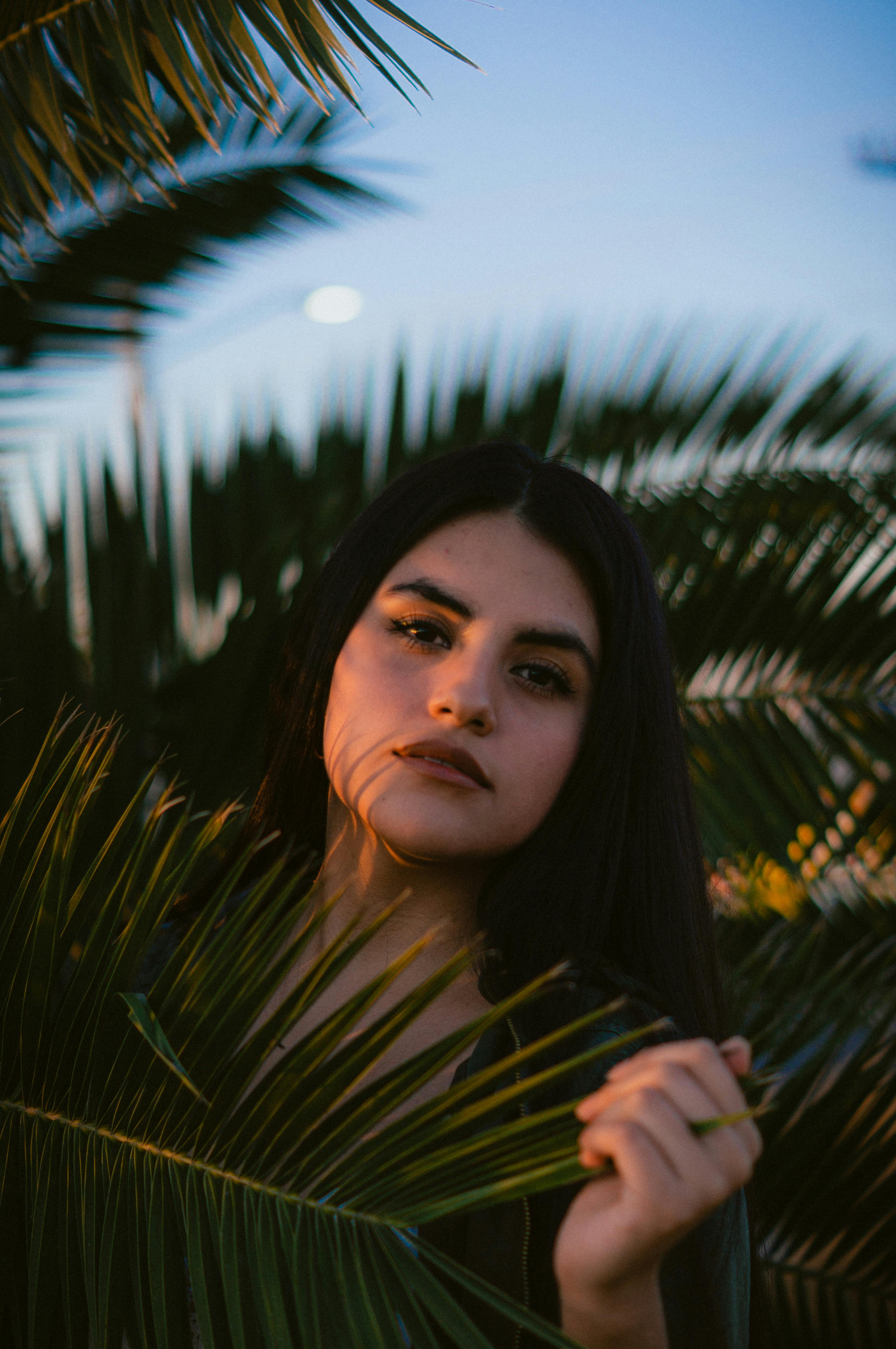 Photo of a Woman in Yellow Sweater Holding Her Head · Free Stock Photo