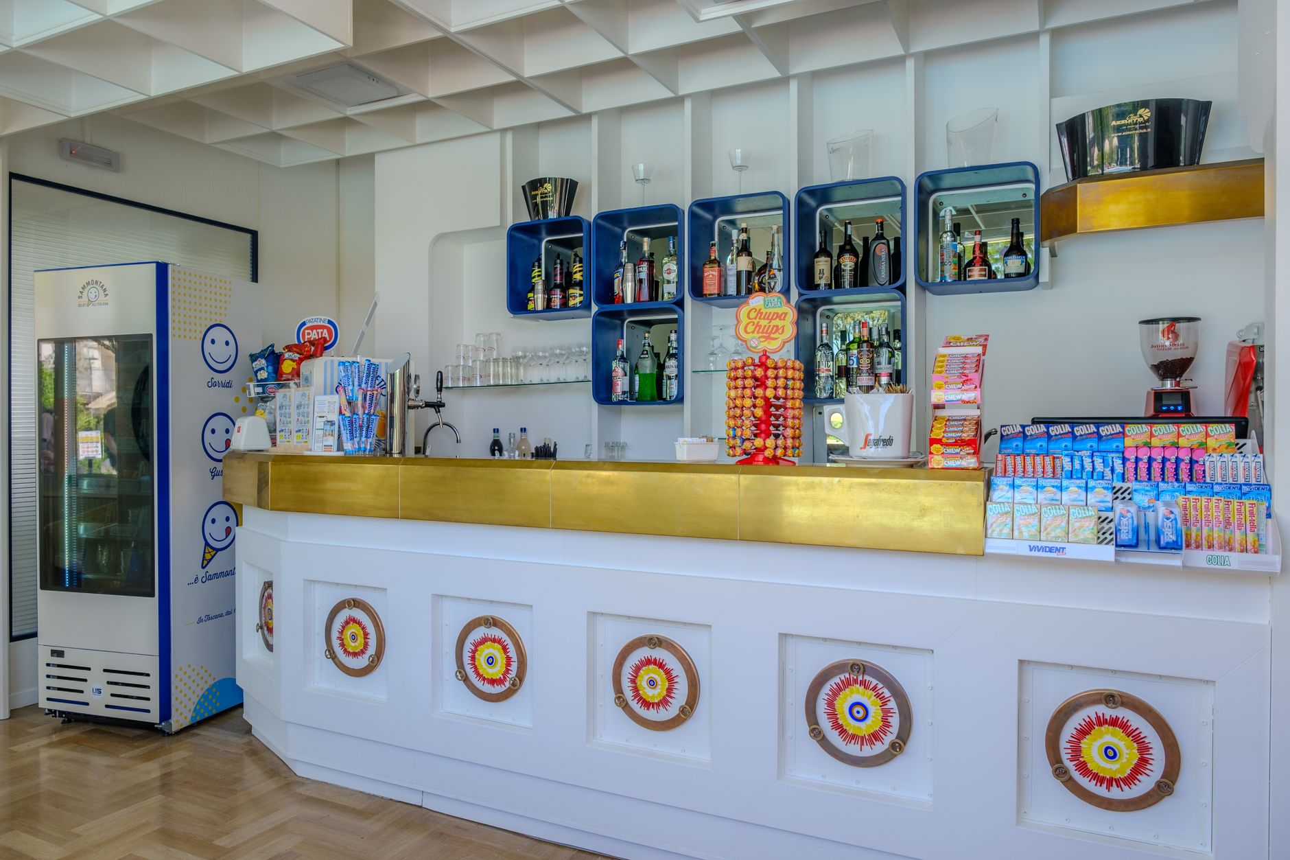Modern bar setup with snacks, drinks, and unique decor elements.