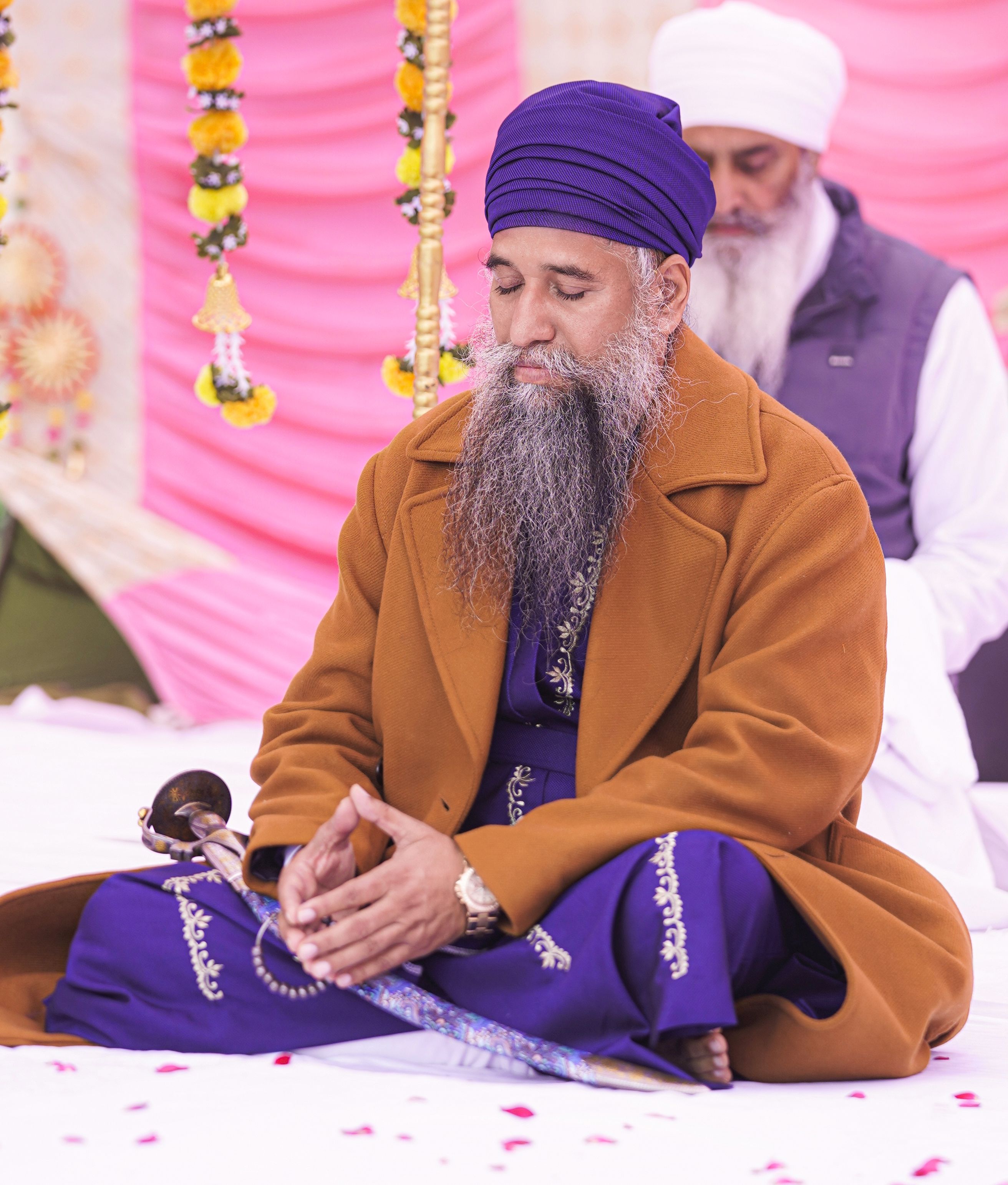 A Sikh man meditating in traditional attire in Maksudra, India, creating a serene atmosphere.