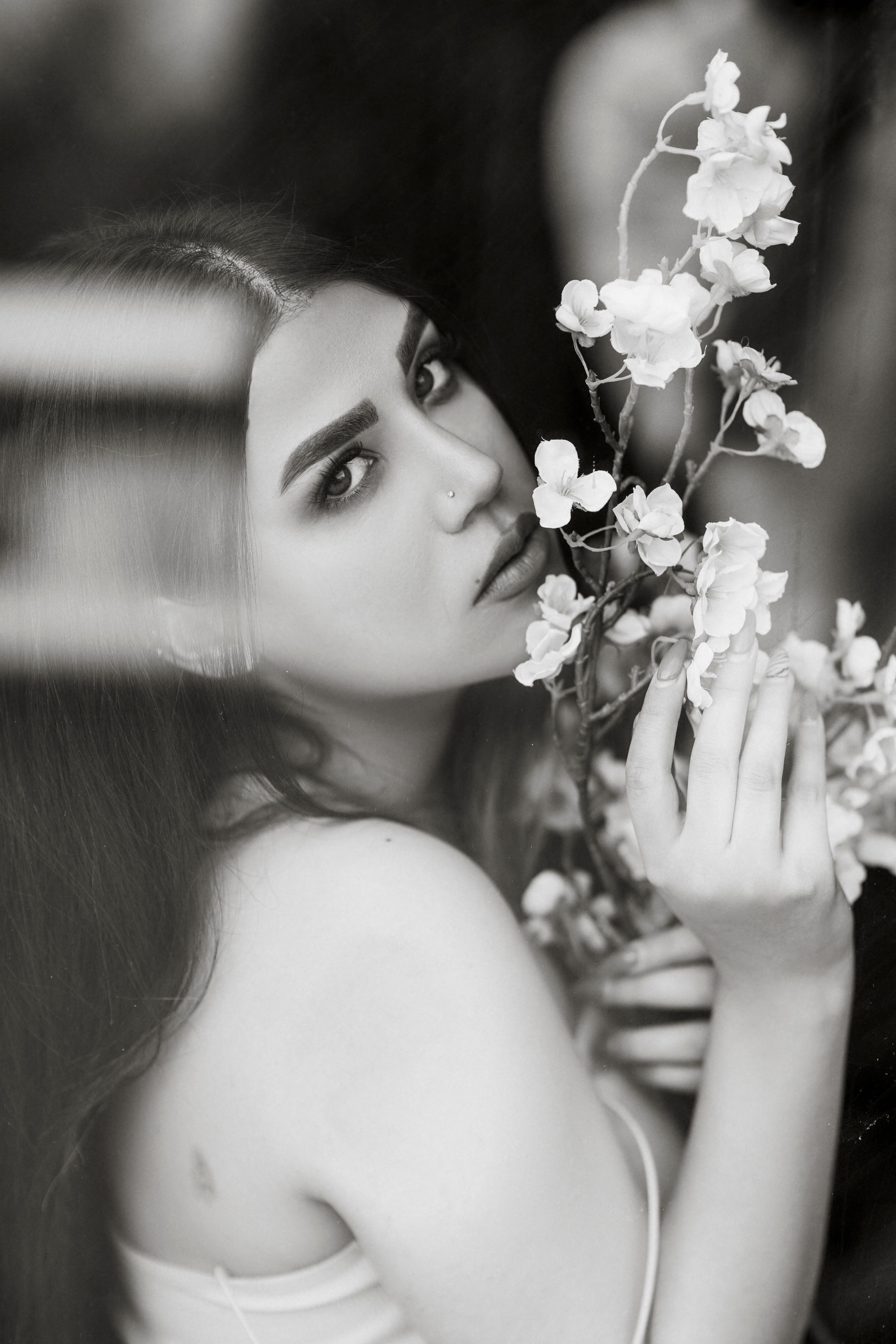 Black and White Portrait of a Woman with Flowers · Free Stock Photo