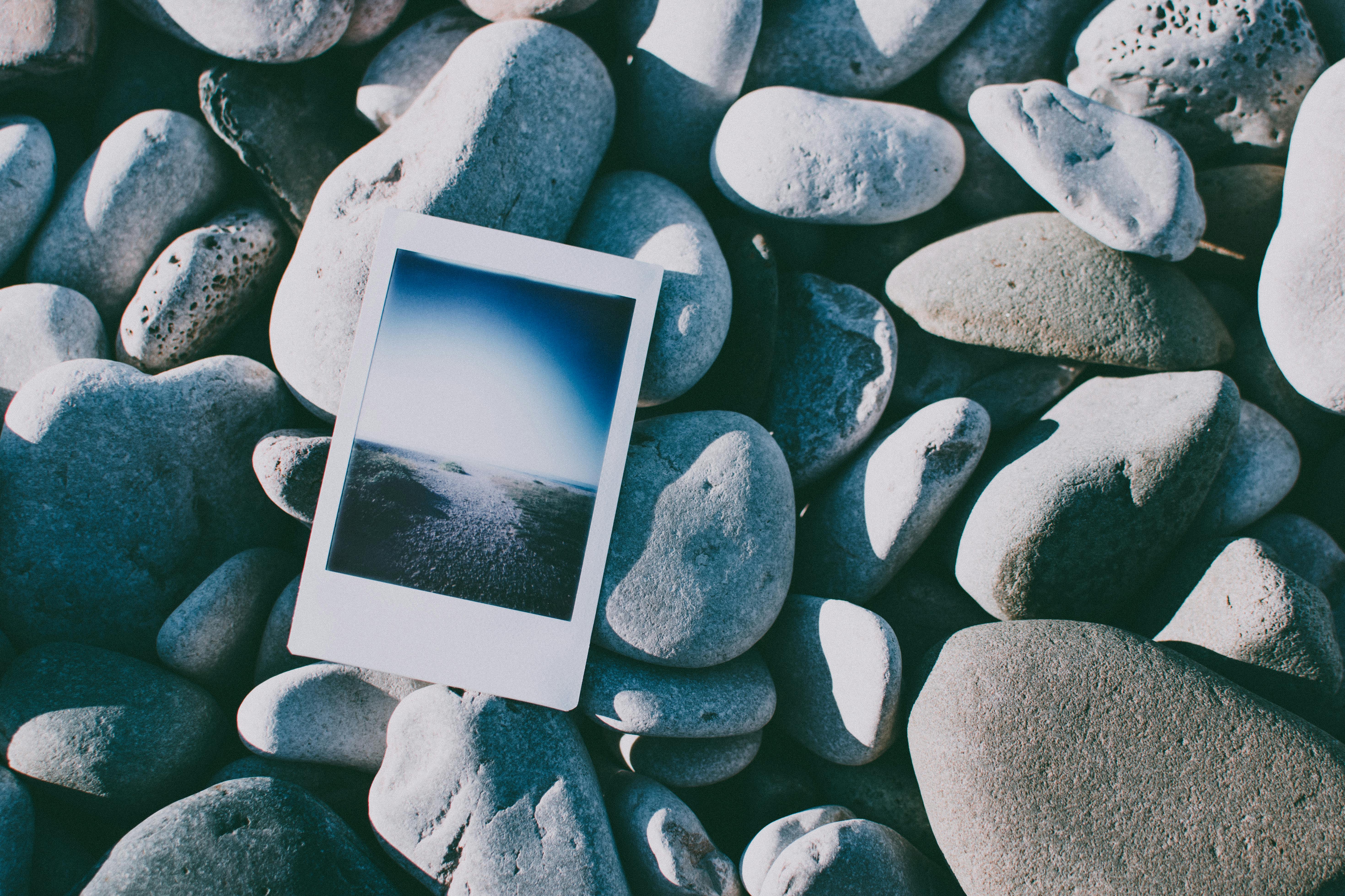 instant photo on rocks