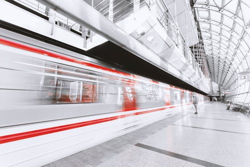 Blurred Motion of Illuminated Railroad Station in City