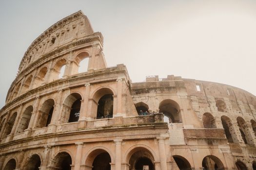 Explore the iconic Colosseum in Rome with this breathtaking low angle shot of the historic landmark.