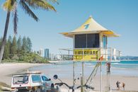 Yellow lifeguard tower overlooking the beach in Coolangatta, QLD, Australia.