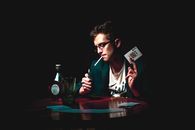 Photo of Man Holding Playing Card