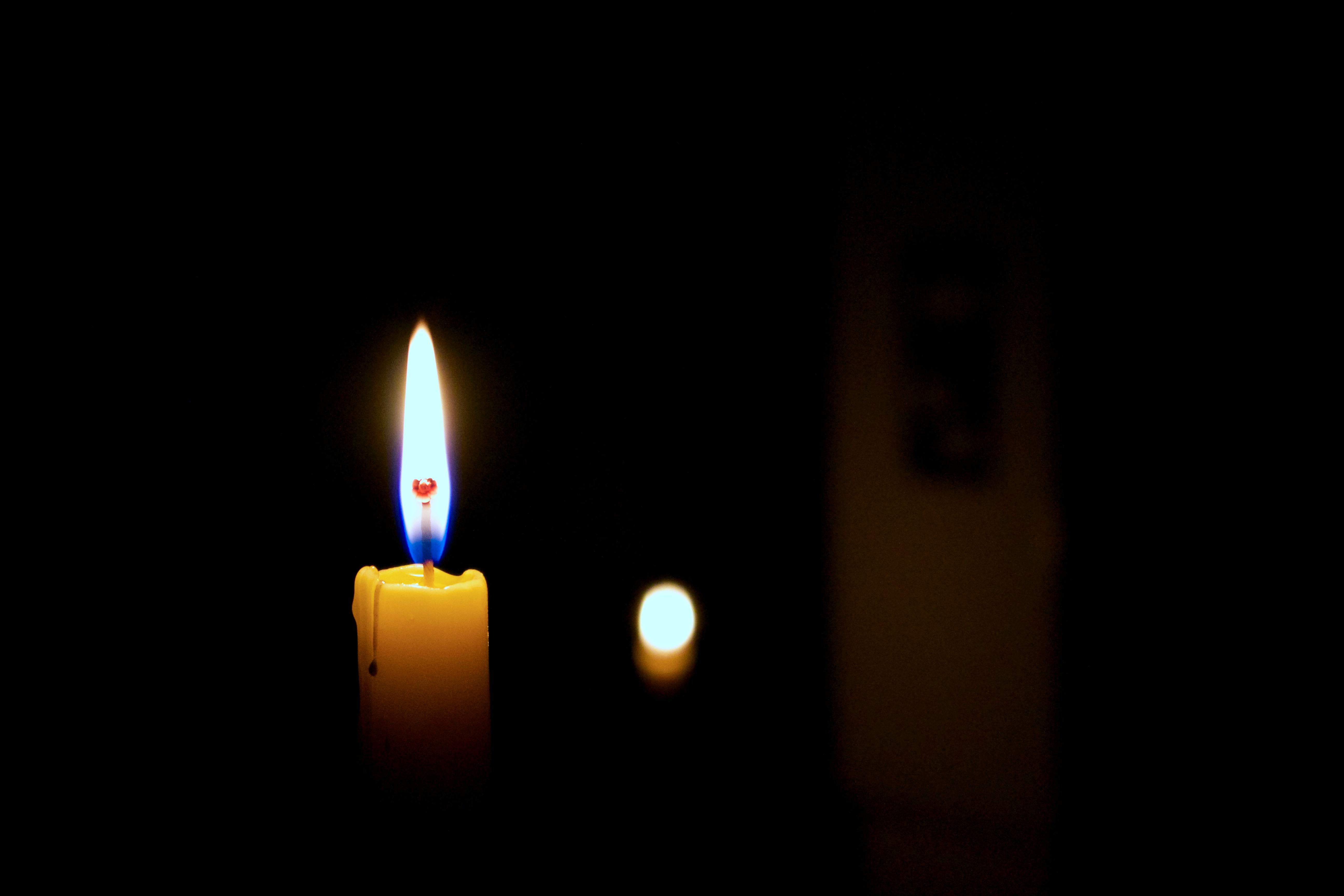 Close-up of Lit Candle in Darkroom · Free Stock Photo