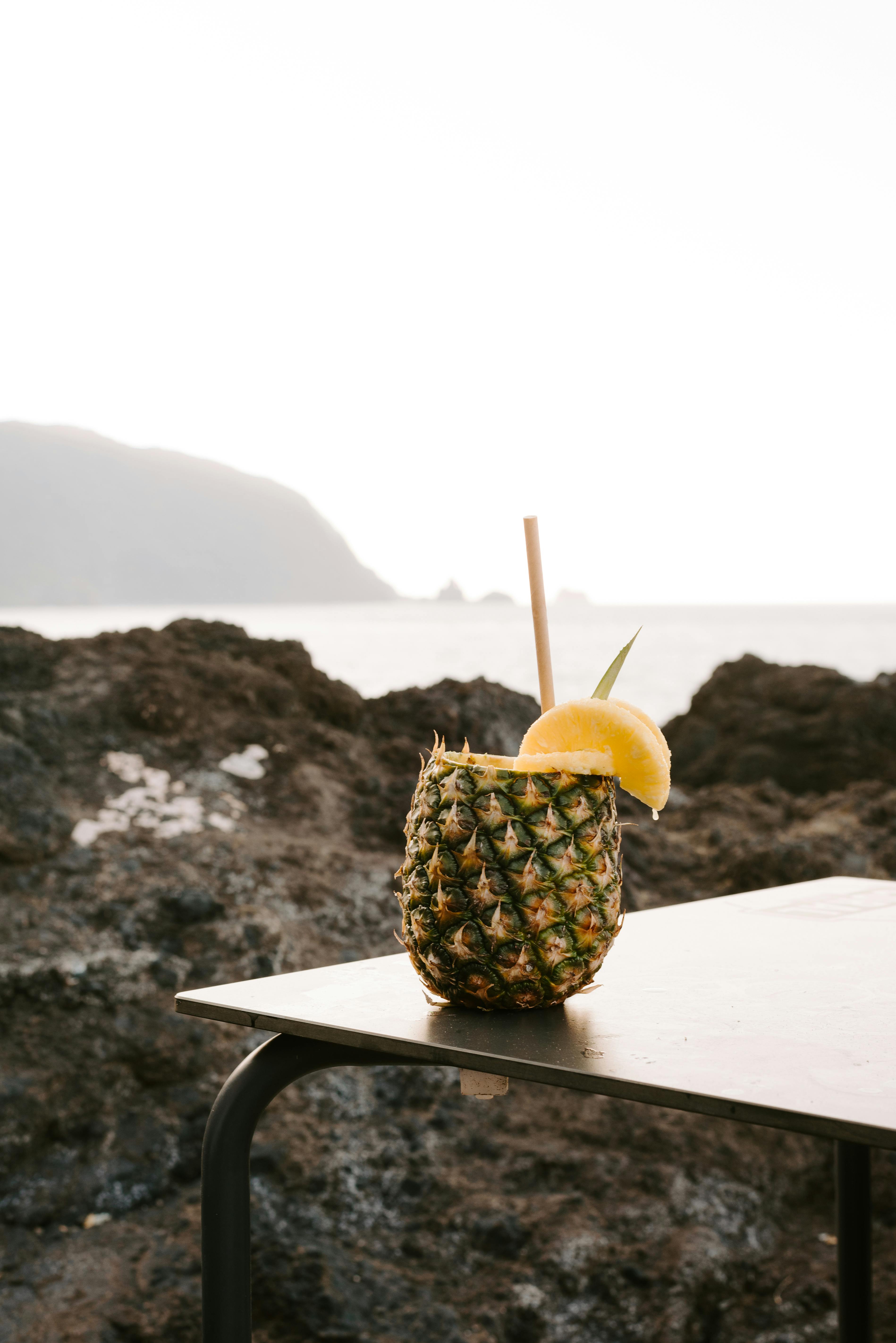Tropical pineapple cocktail with lemon by the seaside in Madeira, Portugal.