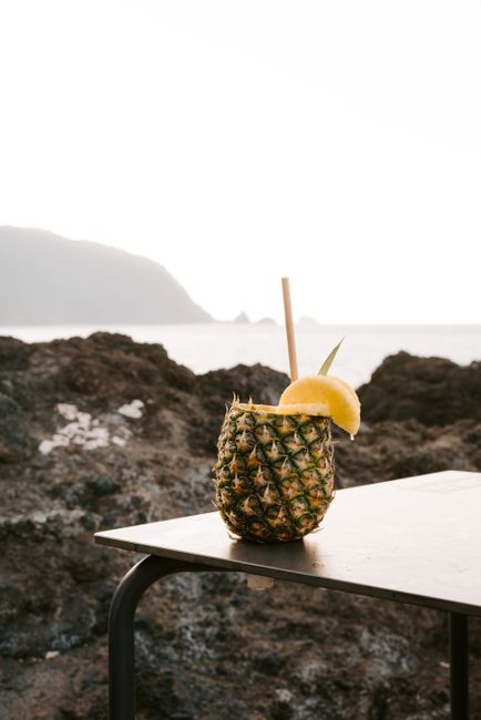 Tropical pineapple cocktail with lemon by the seaside in Madeira, Portugal.