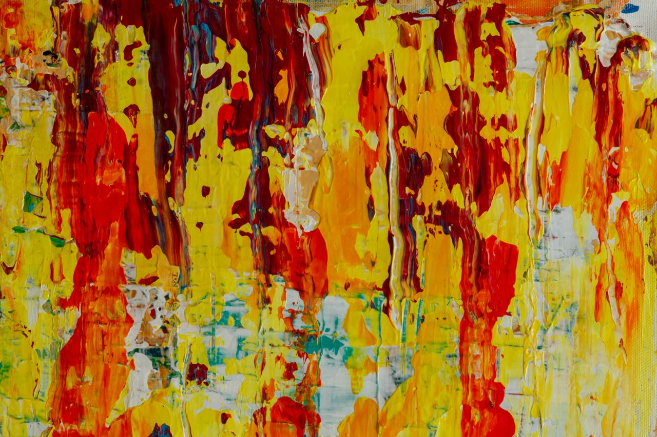 dynamic and colorful abstract painting with vibrant red and yellow dri