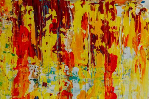 Free Dynamic and colorful abstract painting with vibrant red and yellow drips on canvas. Stock Photo