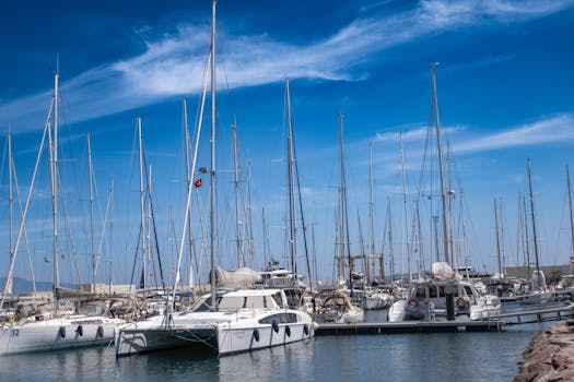 A serene view of sailboats at Foça Marina, İzmir, under a clear blue sky.