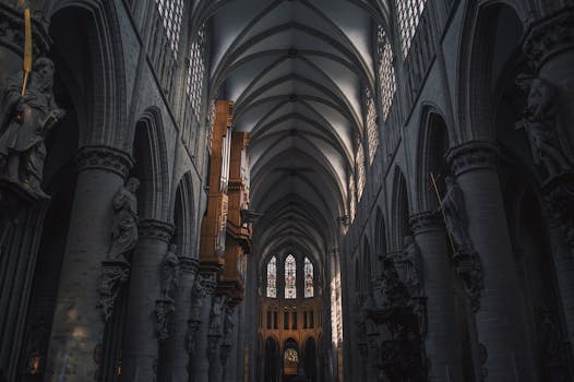 Discover the intricate beauty of a Gothic cathedral interior with towering arches and detailed sculptures.
