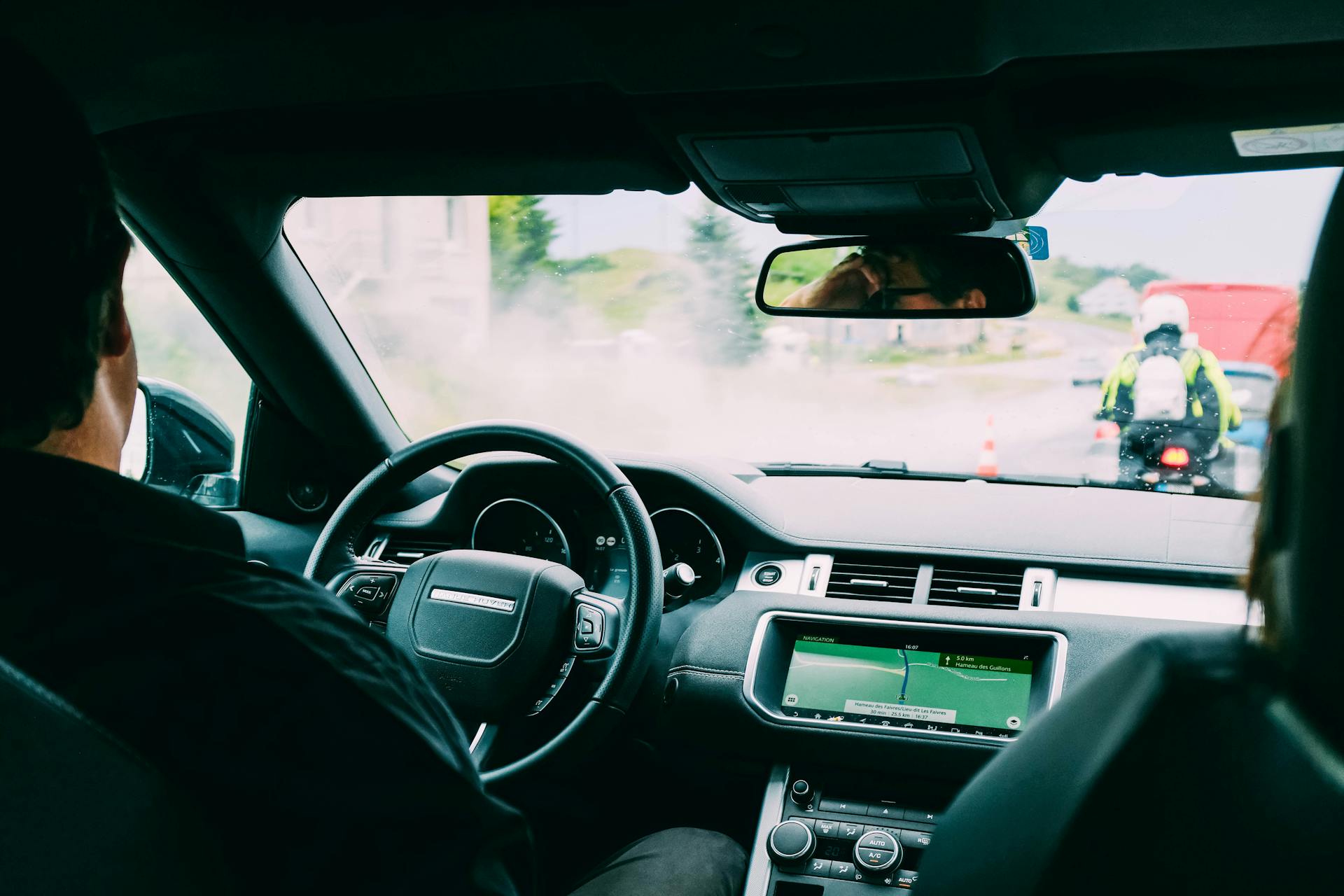 Photo of Man Driving a Car