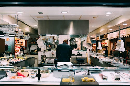 Men Wearing a Black Lapel in a Store