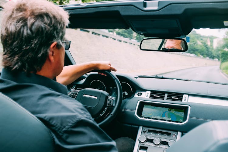 Photo Of Man Driving A Convertible Vehicle