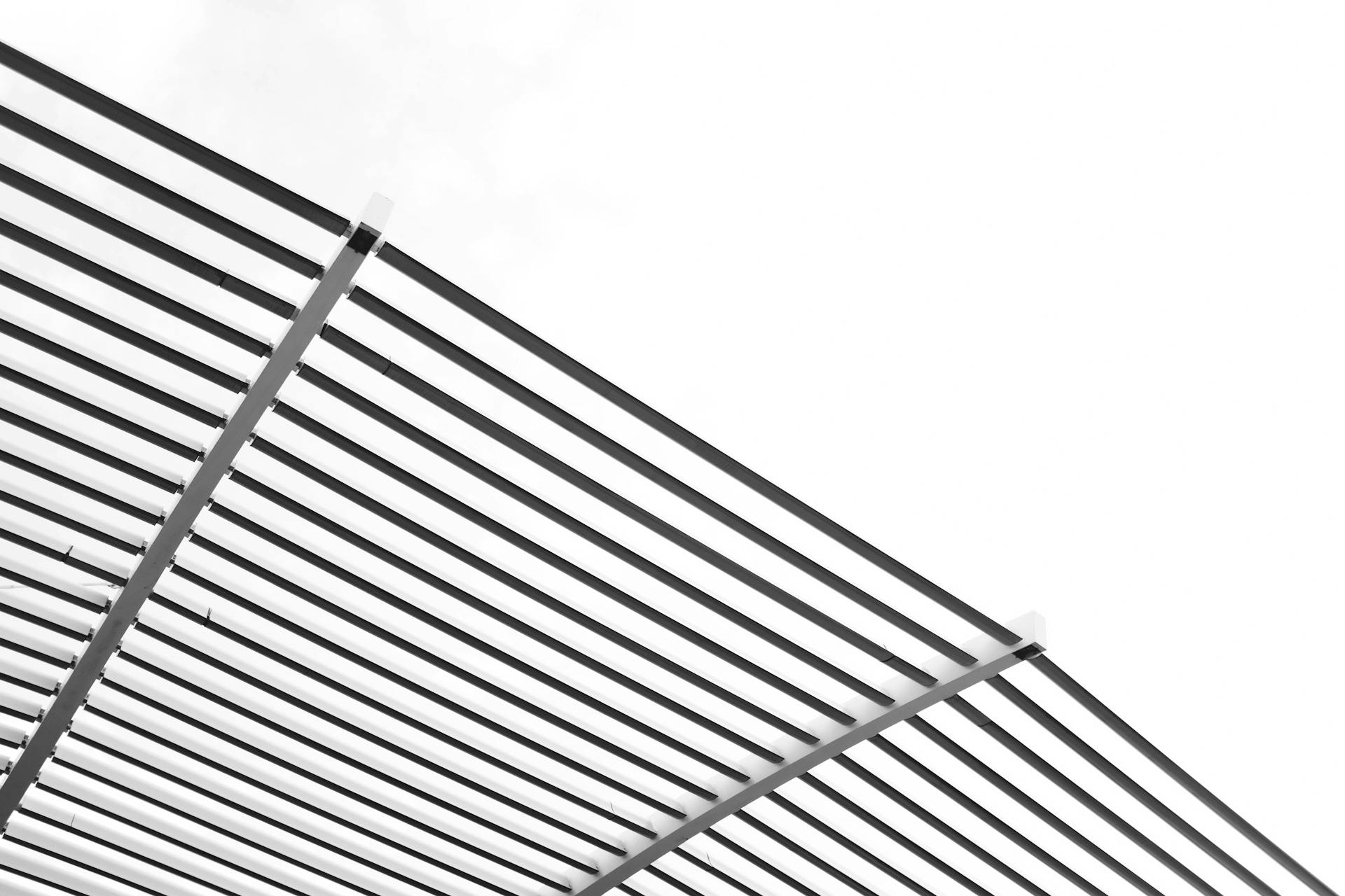 Close-up of modern architectural metal stripes with minimalistic design in daylight.