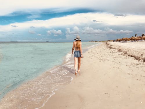 Free Back View Photo of Women Walking by the Beach Stock Photo