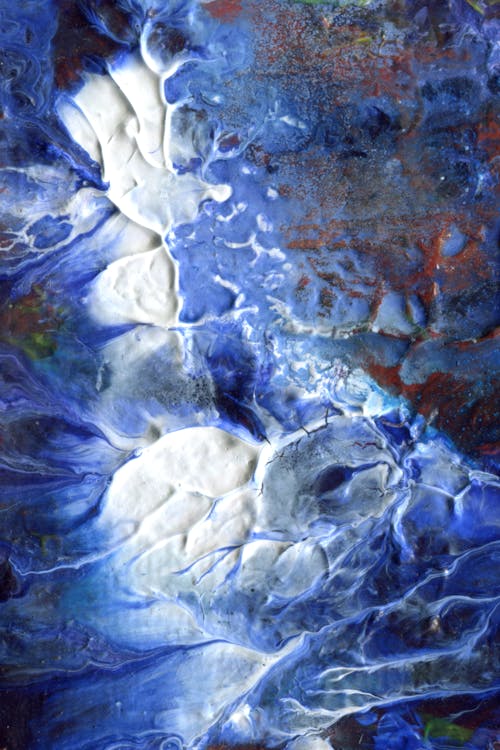 An abstract painting with blue and white colors