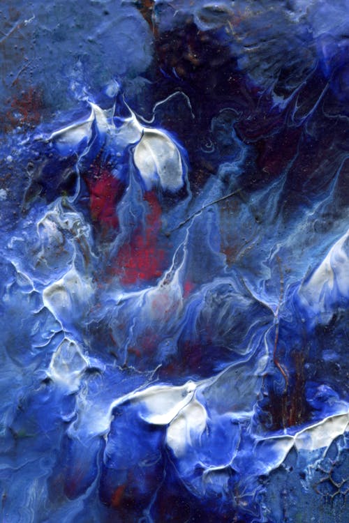 An abstract painting with blue and white flowers