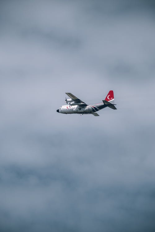 A small airplane flying in the sky