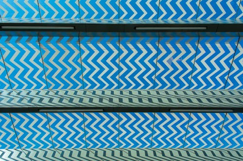 A blue and white patterned ceiling with a zigzag design