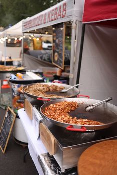 Delicious kebabs at an outdoor food market showcasing diverse street foods.