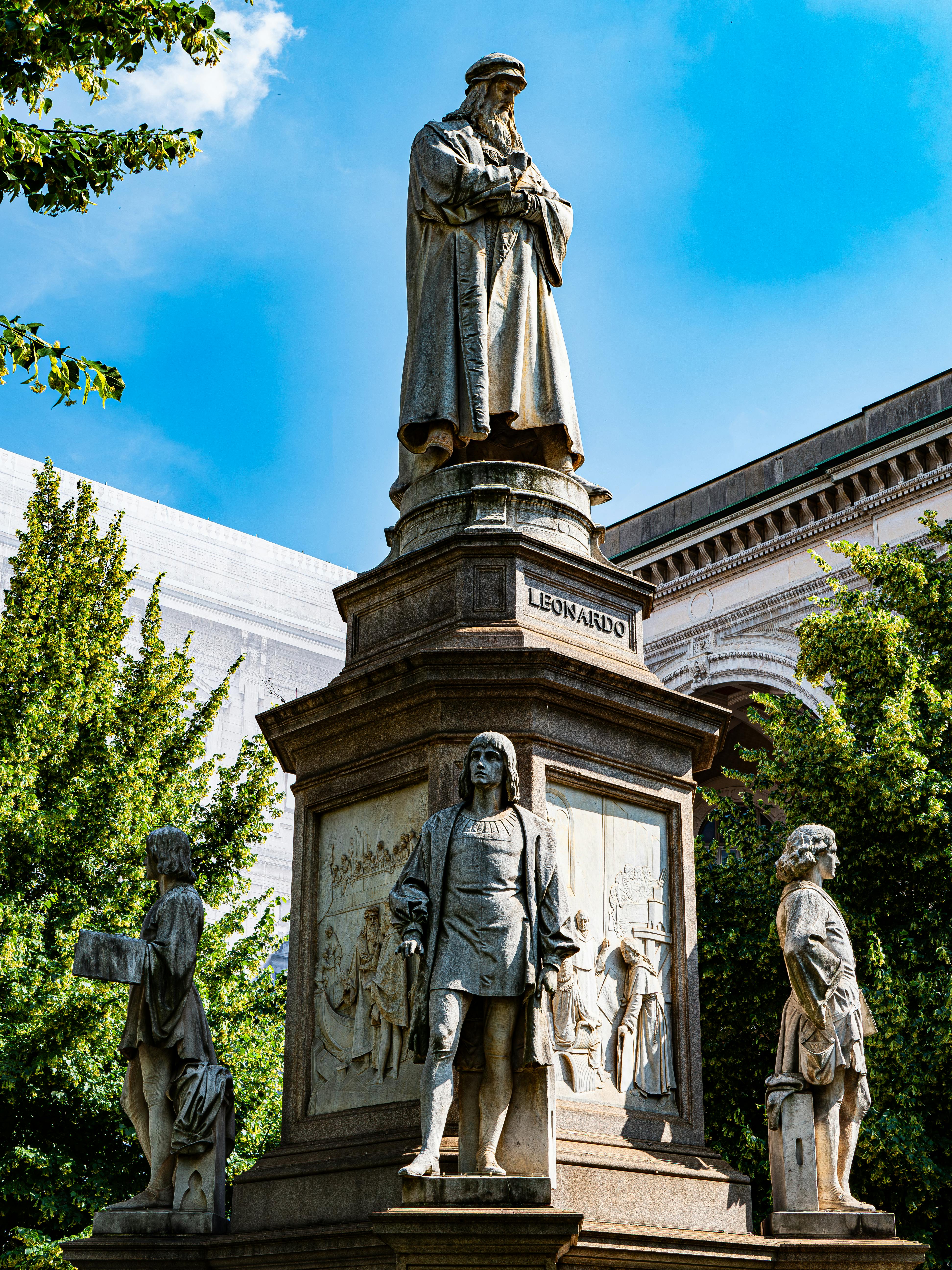 Statue of Leonardo da Vinci with four disciples in Milan, Italy.