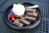 Indulge in chocolate bars with strawberries and ice cream at a gourmet restaurant.