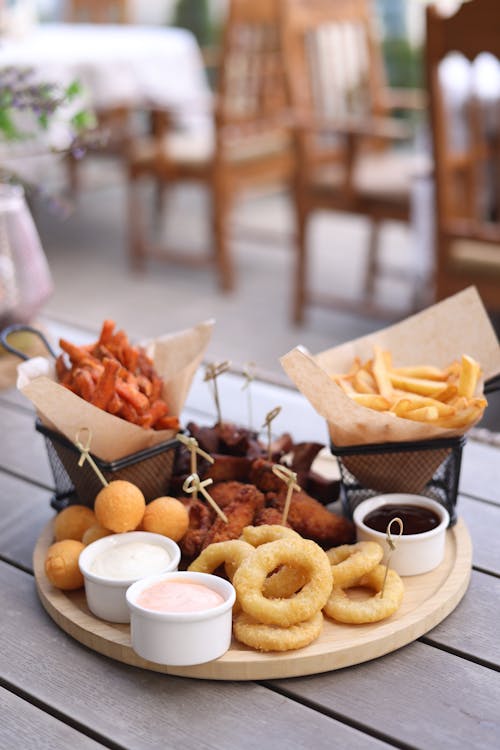 A wooden table with a tray of food on it