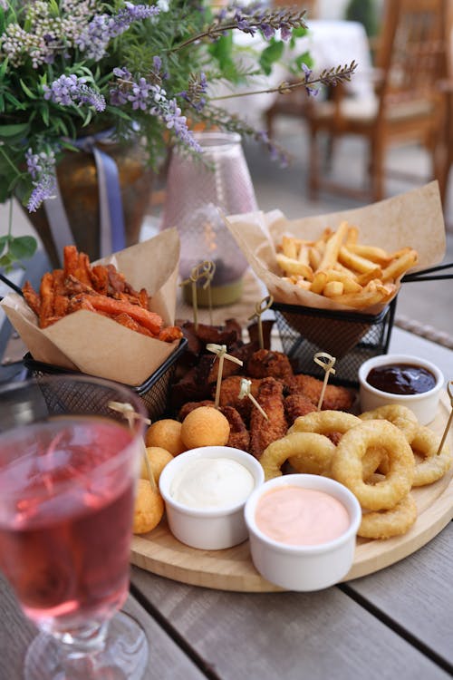 A table with a plate of food and drinks